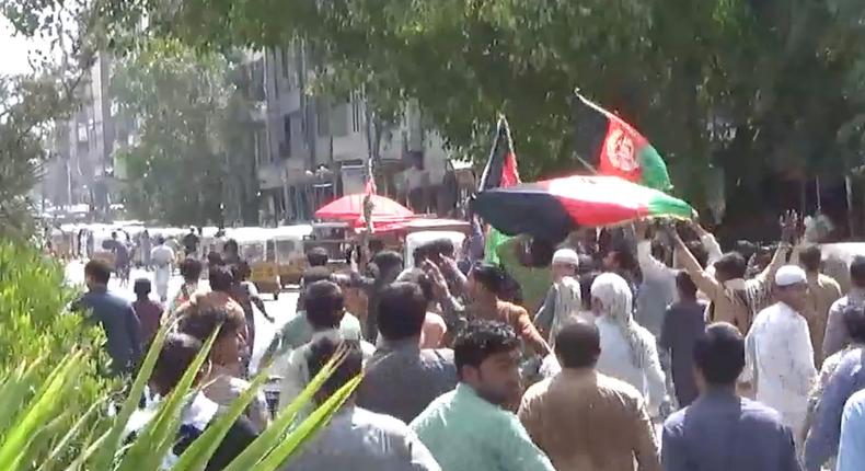 People carry Afghan flags as they take part in an anti-Taliban protest in Jalalabad, Afghanistan August 18, 2021 in this screen grab taken from a video. Pajhwok Afghan News/Handout via REUTERS
