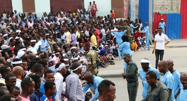 Somalis gather in the capital Mogadishu to commemorate the first anniversary of bombing attack that killed more than 500 people in one of the country's worst ever attacks