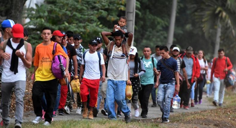 In this file photo taken on April 10, 2019, Honduran migrants hoping to reach the United States leave San Pedro Sula, 300 kms north of Tegucigalpa, to travel to the Guatemalan border