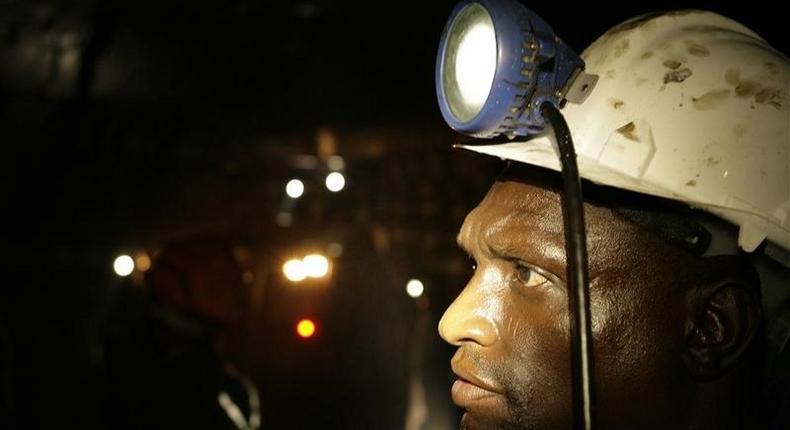 A mine worker looks on underground in Modderfontein east mine, outside Johannesburg, February 3, 2009. REUTERS/Siphiwe Sibeko