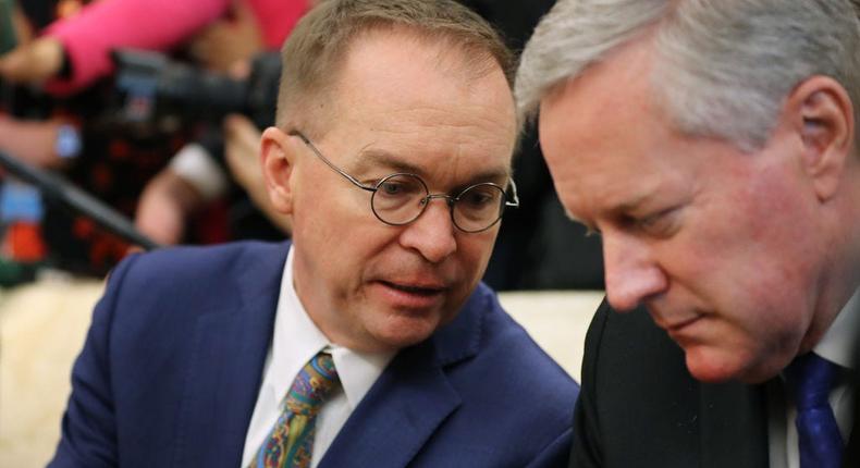 Mark Meadows, right, confers with Mick Mulvaney in the Oval Office on March 12, 2020.