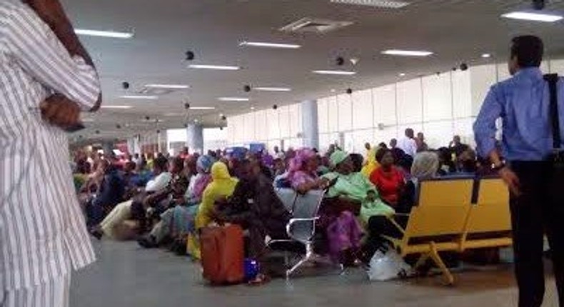 Passengers stranded at the airport on Thursday.