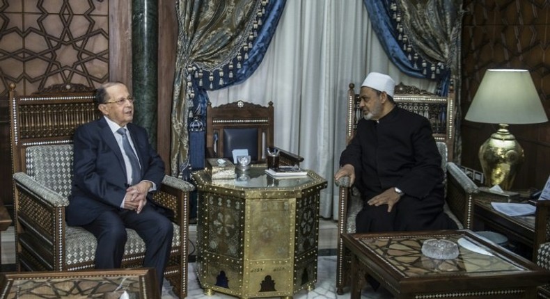 Egypt's Grand Imam of al-Azhar Sheikh Ahmed Mohamed al-Tayeb (right) receives Michel Aoun at his office in Cairo on February 13, 2017