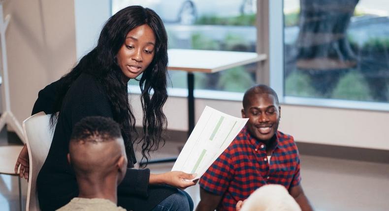 Coworkers in a heated discussion in an office setting [Image Credit: Kindel Media]