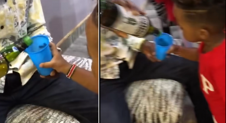 Screenshots from a video which circulated online showing an adult giving whiskey to a 3-year-old child.