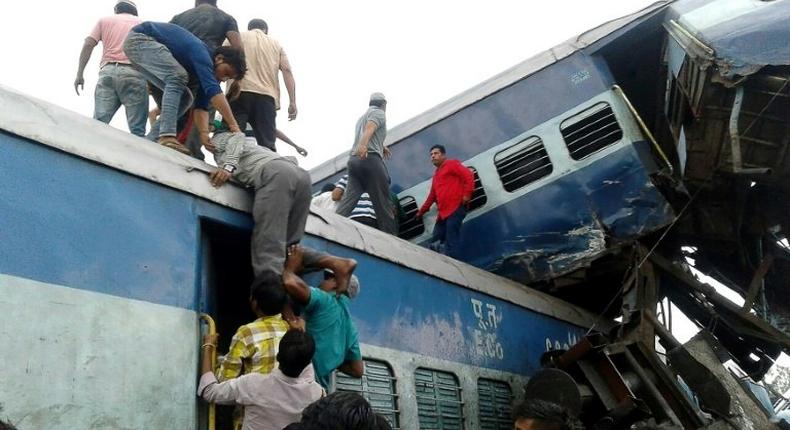 Local residents search for survivors of the train crash