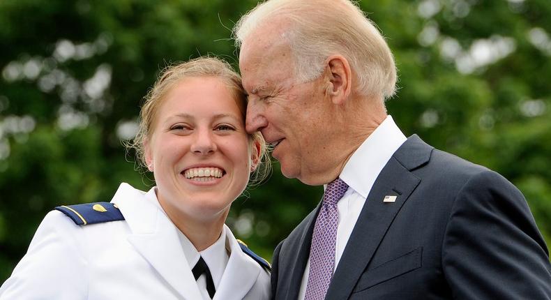 Newly commissioned officer Erin Talbot, left, poses for a photograph with Vice President Joe Biden during commencement for the United States Coast Guard Academy in 2013.