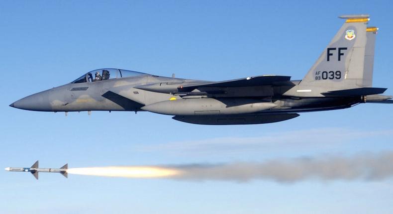 An F-15 Eagle fires an AIM-7 Sparrow medium-range air-to-air missile during a weapons system evaluation.