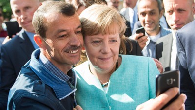 Merkel visits refugee shelter