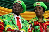 FILE PHOTO: Zimbabwean President Robert Mugabe and his wife Grace attend a meeting of his ruling ZAN