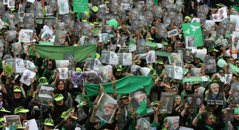 Supporters of then Iranian presidential candidate Mir Hossein Mousavi wave green flags - his campaign colour - at a pro-reform rally in Tehran on June 9, 2009