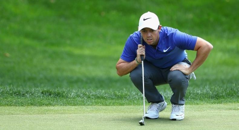 Rory McIlroy of Northern Ireland lines up a putt on the 18th green during the final round of the Travelers Championship at TPC River Highlands on June 25, 2017 in Cromwell, Connecticut
