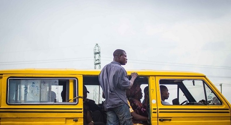 A Lagos danfo and its conductor