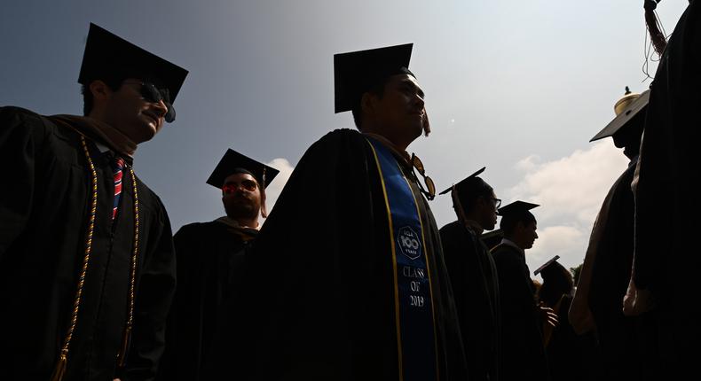 College graduates.Robyn Beck/AFP via Getty Images
