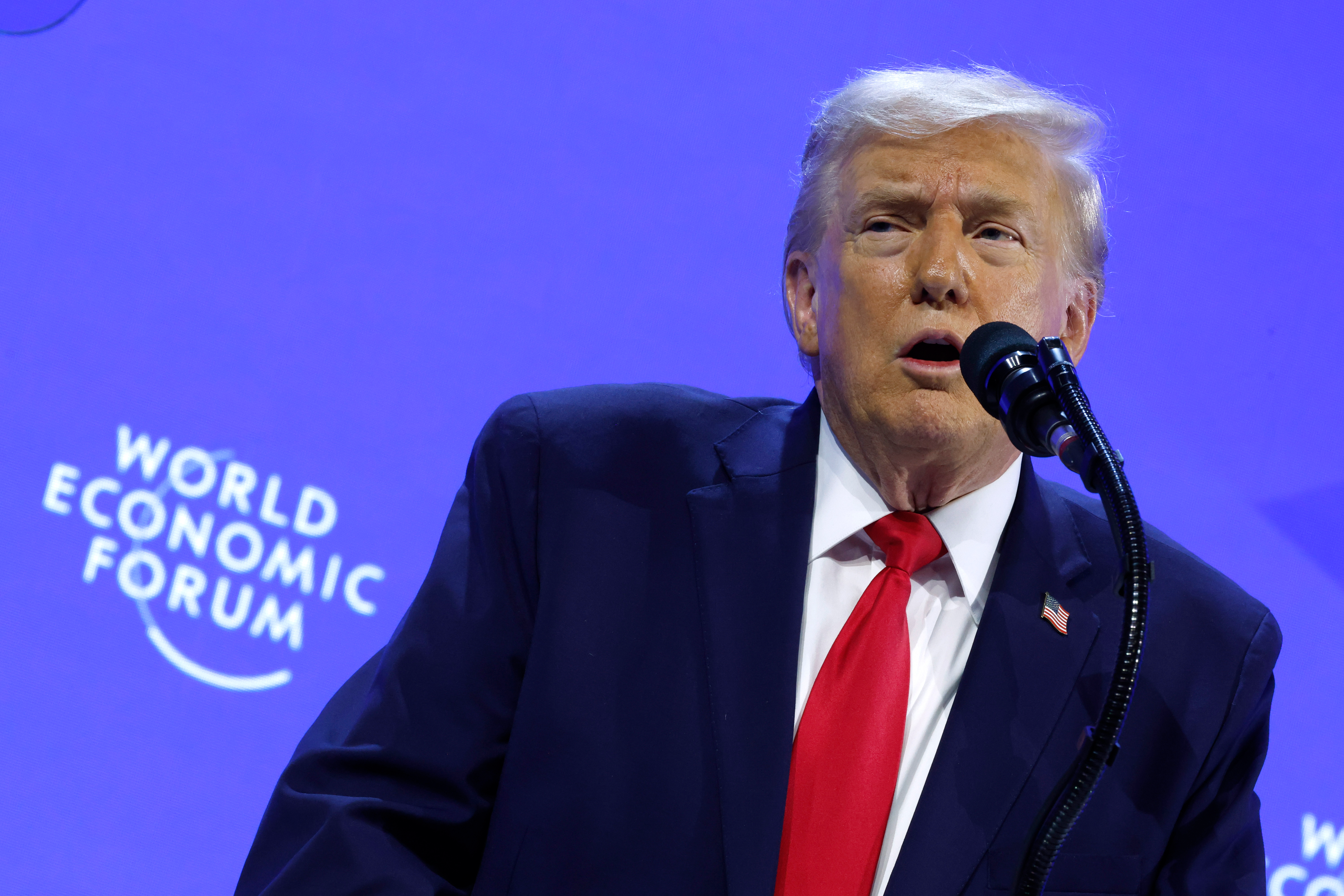 Trump mocks Macron's eyewear, threatens up to 200% tariffs at Davos