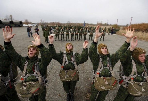 Conscripts, willing to join Russian airborne forces, train before boarding a plane during parachute 