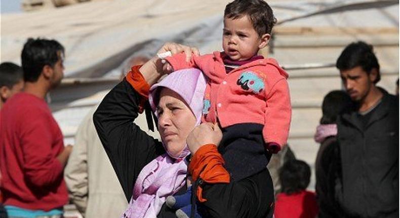 Britain says will take in hundreds more women and children from Syria