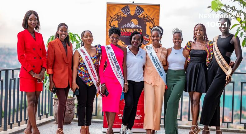 Diana Kahunde (C), the Stanbic Bank Marketing Manager Personal and Private Banking (PPB) poses for a photo with some of the beauty queens at the launch