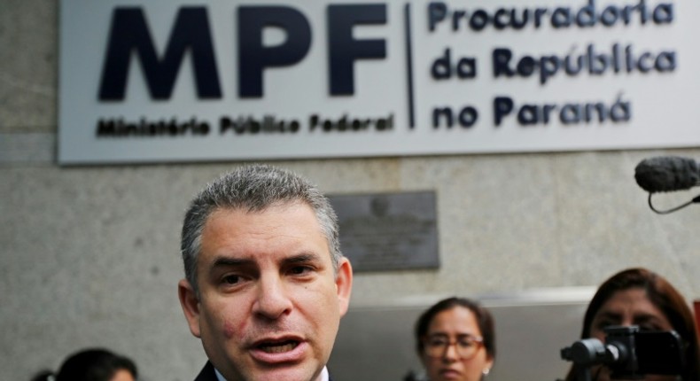 Peru's public prosecutor Rafael Vela, shown speaking to reporters in Curitiba, Brazil, said Odebrecht's former chief in Peru detailed money routes to Peruvian politicians