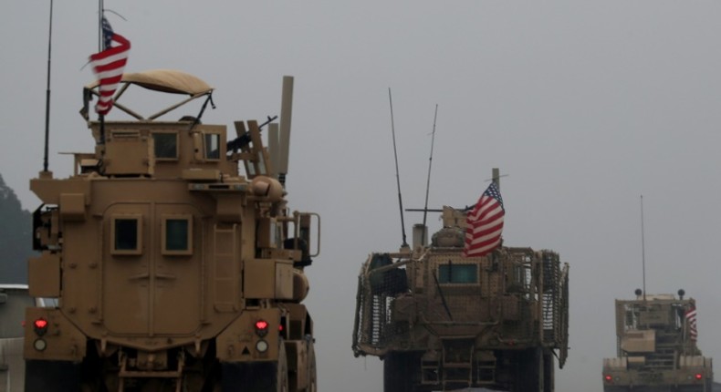 File picture taken on December 30, 2018, shows a convoy of US military vehicles in Syria's northern city of Manbij