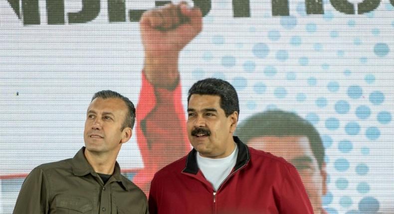 Venezuelan President Nicolas Maduro (right) and his Vice-President Tareck El Aissami participate in a Caracas rally on January 31, 2017