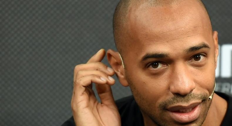 Former French striker Thierry Henry gestures as he speaks with the media during a promotional event in Mumbai on October 26, 2016