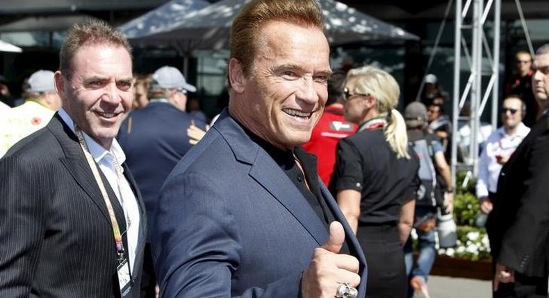 Actor Arnold Schwarzenegger reacts as he arrives at the Australian Formula One Grand Prix in Melbourne. 