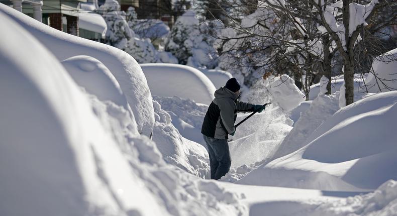 A resident shovels snow away from the entrance to his home in Union City, New Jersey, across the Hudson River from Midtown Manhattan, after the second-biggest winter storm in New York history.