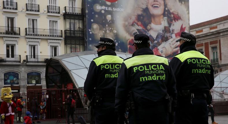 Police officers patrol at Puerta del Sol square ahead of New Year's celebrations in central Madrid, Spain, December 31, 2016.