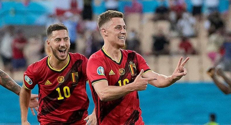 Thorgan Hazard (R) celebrates with his brother Eden after scoring Belgium's goal against Portugal in Seville Creator: THANASSIS STAVRAKIS