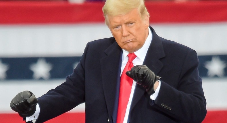 Then-President Donald Trump dances at the end of a rally in Bern Township, Pennsylvania on October 31, 2020.