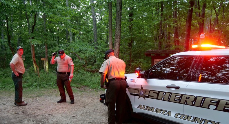 Authorities secure the entrance to Mine Bank Trail, an access point to the rescue operation along the Blue Ridge Parkway where a Cessna Citation crashed over mountainous terrain near Montebello, Virginia.Randall K. Wolf/AP