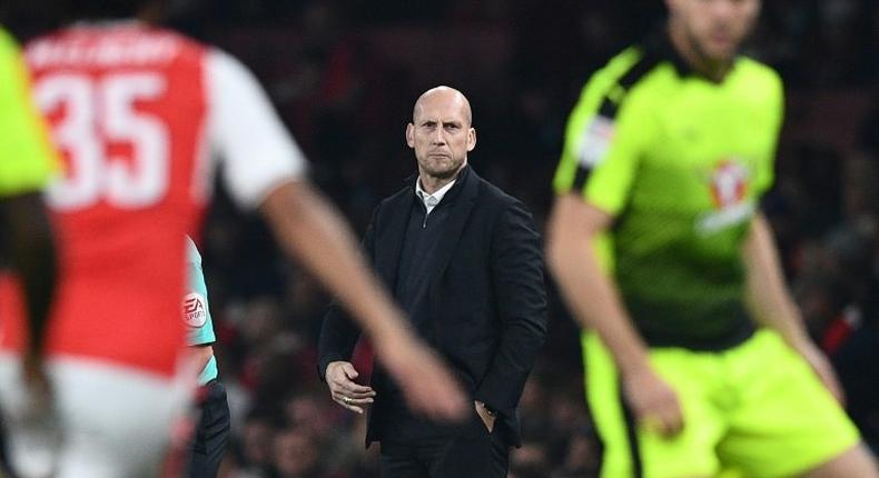 Reading's Dutch manager Jaap Stam watches from the touchline their English Football League Cup match against Arsenal, at The Emirates Stadium in London, on October 25, 2016