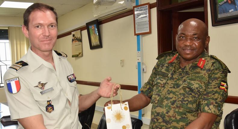 Maj. Gen. Jackson Bakasumba with Lt. Col. Yam Chollet