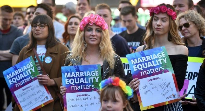 This picture taken on August 6, 2017 shows supporters of marriage equality at a protest march in Sydney
