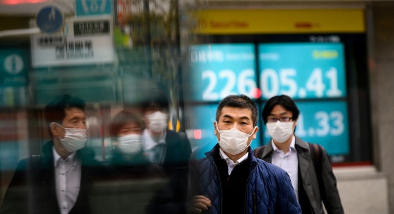 Pedestrians wearing face masks against the spread of the coronavirus spotted on a street in Tokyo