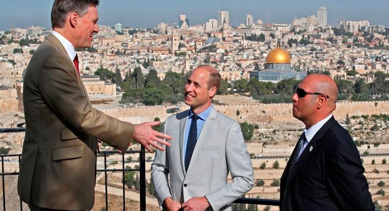 Prince William (center) and British Consul General in Jerusalem Philip Hall (left) talk to a guide on Jerusalem's Mount of Olives overlooking the Old City of Jerusalem.THOMAS COEX/AFP via Getty Images