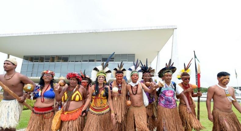 Indigenous people occupy the outer galleries of the presidential palace in protest against industries that threaten their livelihood, in Brasilia on November 22, 2016