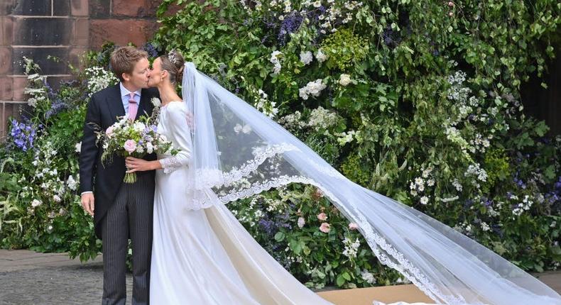 Hugh Grosvenor, 7th Duke of Westminster and Olivia Henson kiss as they depart their wedding at Chester Cathedral on Friday.Dave Benett/Getty Images