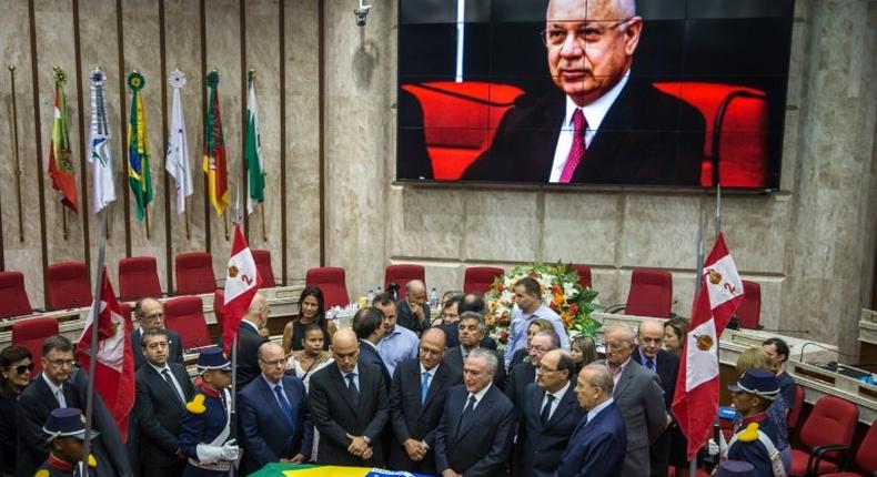 Brazilian President Michel Temer (3rd-R) attends the funeral of Supreme Court Justice Teori Zavascki at the Federal Regional Court of the 4th Region, where the wake is being held in Porto Alegre on January 21, 2017