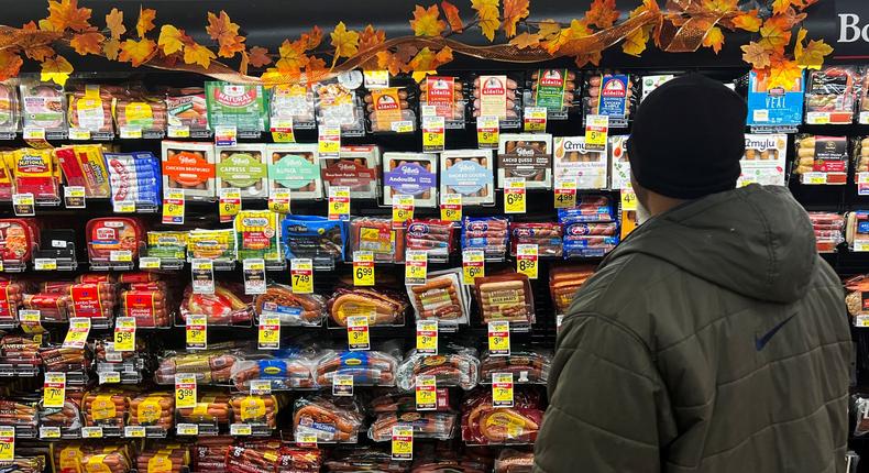 A shopper looking at displayed food at a supermarket ahead of the Thanksgiving holiday in Chicago on November 22, 2022.JIM VONDRUSKA/Reuters