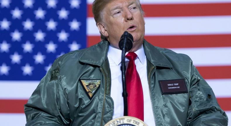 President Donald Trump addresses US troops in Iraq during a lightning surprise visit to Al-Asad Air Base on December 26, 2018