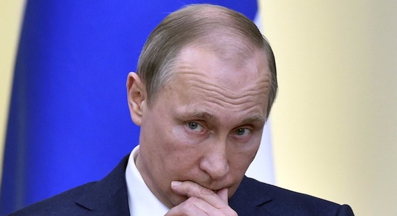 Russian President Vladimir Putin attends a joint news conference.