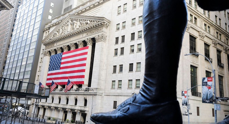 Aggressive Federal Reserve interest rate cuts and oil's price falling over 50% could shock markets next year, according to Standard Chartered.Wang Ying/Xinhua/Getty