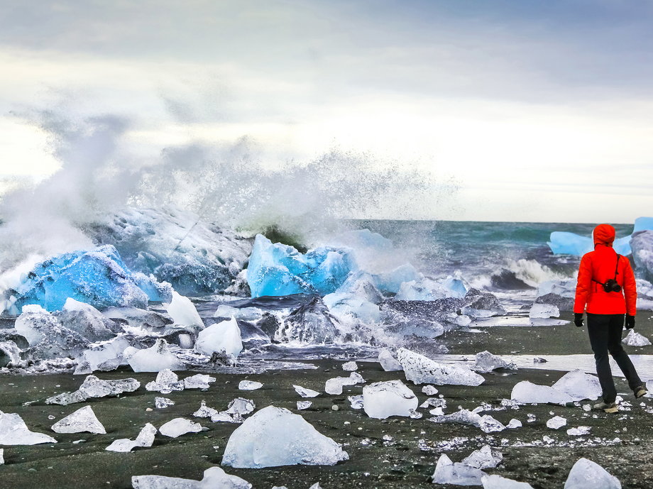As the glacier recedes, massive chunks of ice break off of it and into the lagoon, where they start floating toward the ocean.