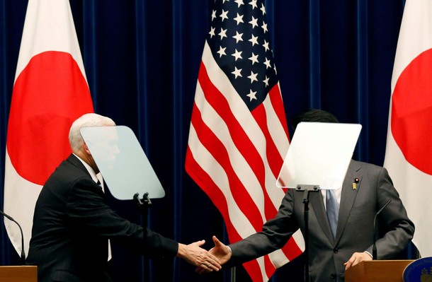 U.S. Vice President Pence and Japan's PM Abe shake hands during their joint announcement after their