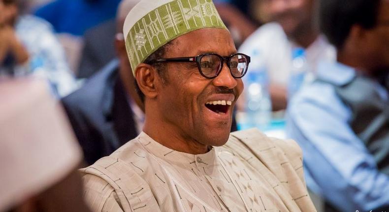 President Muhammadu Buhari laughing