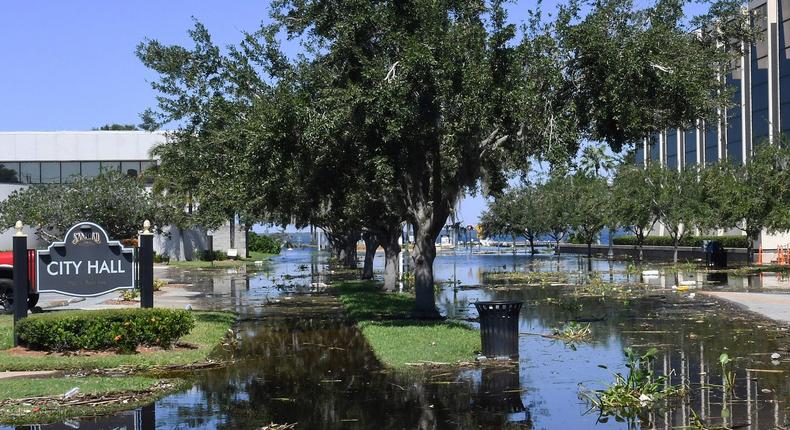 Street flooding is seen near City Hall and the Seminole County Courthouse as the St. Johns River reaches major flood stage, causing Lake Monroe to breach the sea wall in the aftermath of Hurricane Ian in downtown Sanford.Pauln Hennessy/SOPA Images/LightRocket via Getty Images