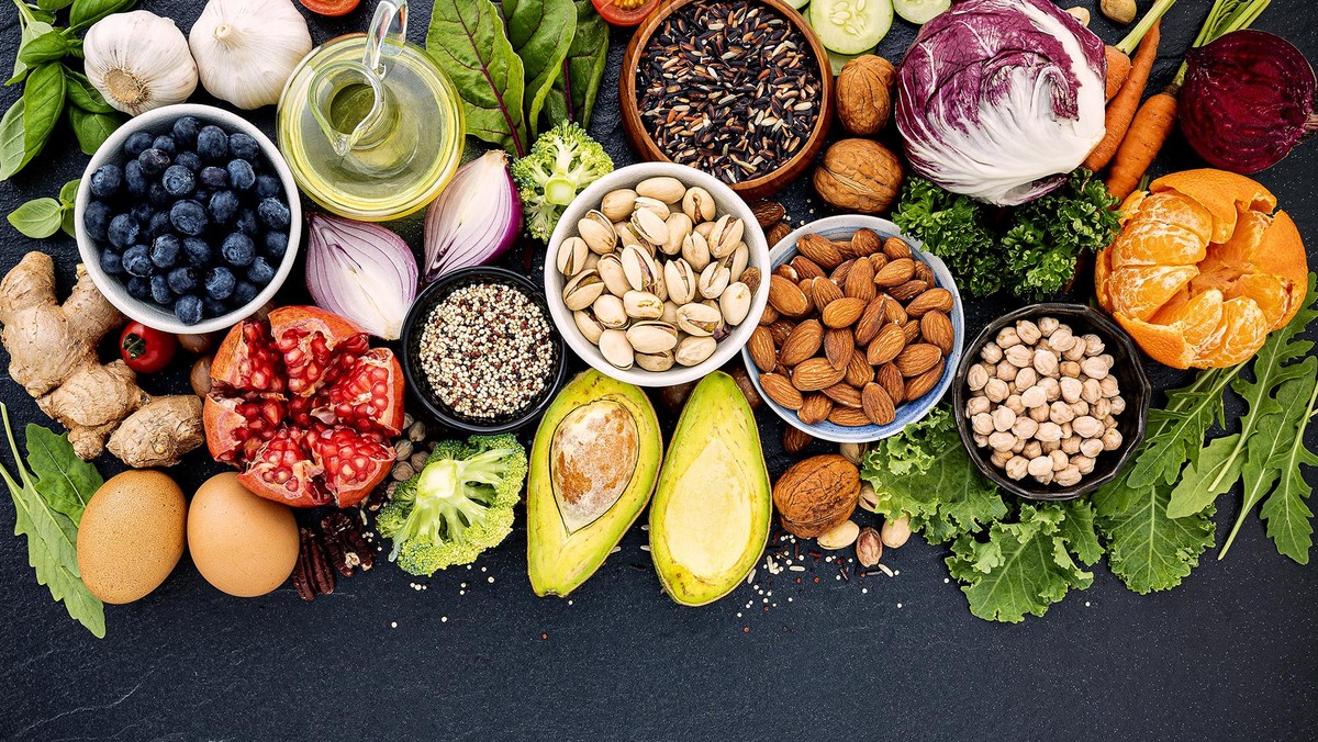 Ingredients for the healthy foods selection. The concept of healthy food set up on dark stone background.