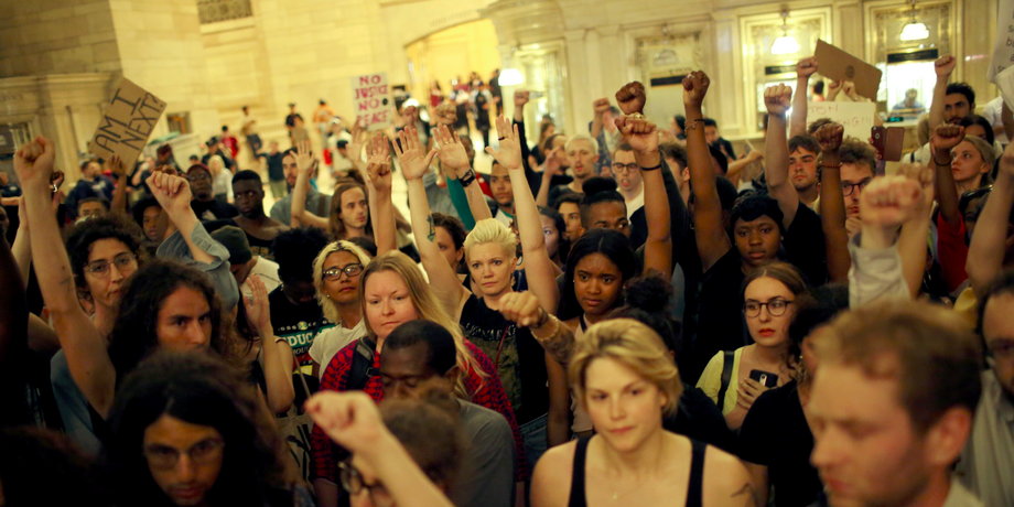 People go into Grand Central Station while they take part in a protest against the killing of Alton Sterling, Philando Castile and in support of Black Lives Matter during a march along Manhattan's streets in New York July 8, 2016.